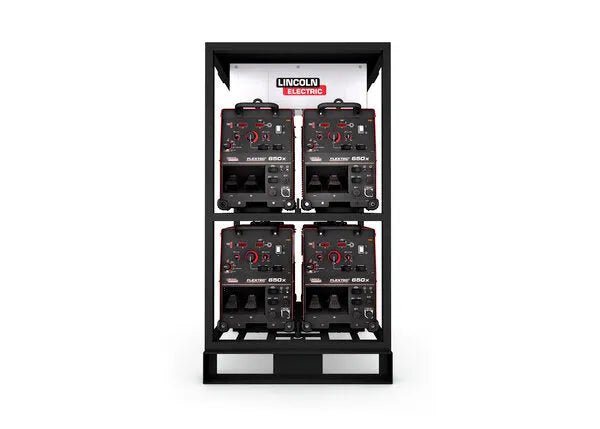 The Lincoln Flextec¨ 650X 4-Pack Rack (K3510-1) is a black metal rack that holds four Flextec 650X welders in two rows of two, with control panels visible and the Lincoln Electric logo displayed at the top.