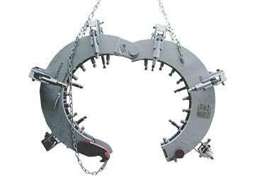 Mathey Dearman Mega Rim Clamp D711-2026M for 20-26" pipes, heavy-duty welding tool with adjustable arms, shown hanging by chains.