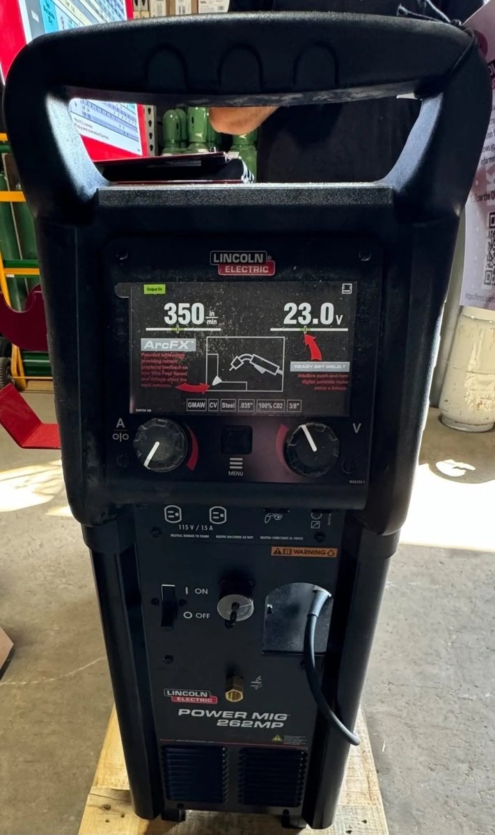 Lincoln Power MIG 262MP Multi-Process Welder on concrete floor, digital display 350 amps, ideal for aluminum welding tools.