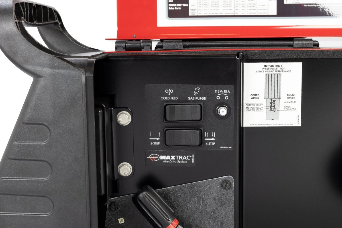Lincoln Power MIG 262 Welder control panel close-up with labeled cold feed, gas purge controls, and instruction chart by WeldingMart.