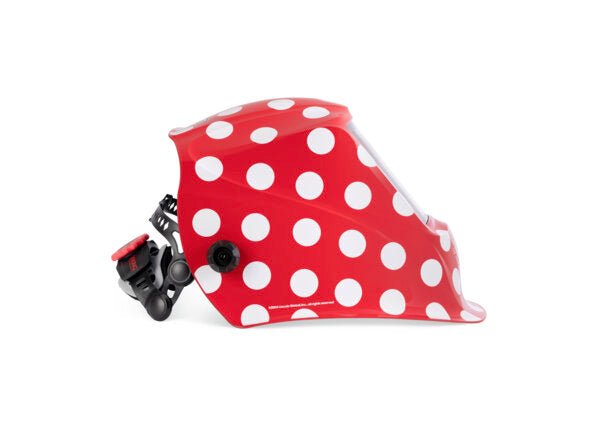 Red bike helmet with white polka dots, side view, adjustable strap—bold design rivals VIKING 3350 ADV welding helmet style.