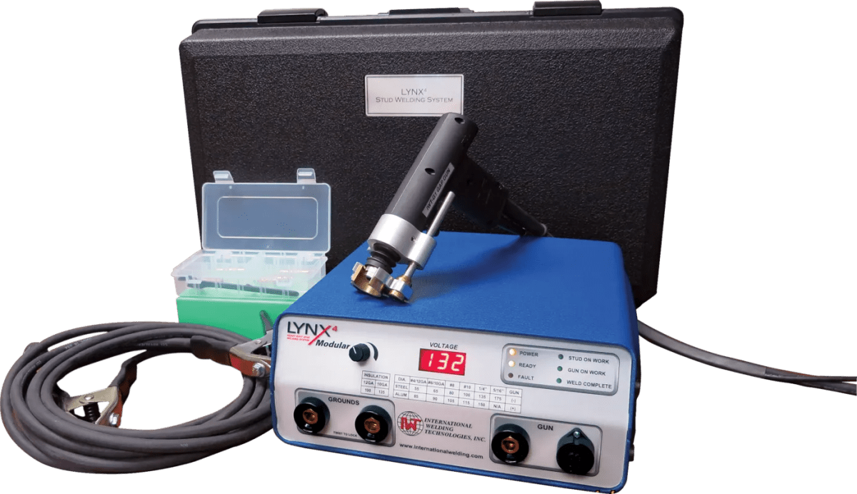 The IWT LYNX4 Modular (5/16” Capacity) Capacitor Discharge Stud Welding System (1-IWT500054M4) includes a blue and white unit with a digital display, knobs, ports, soldering-gun-style tool, coiled cable, black case, and compartmentalized box.