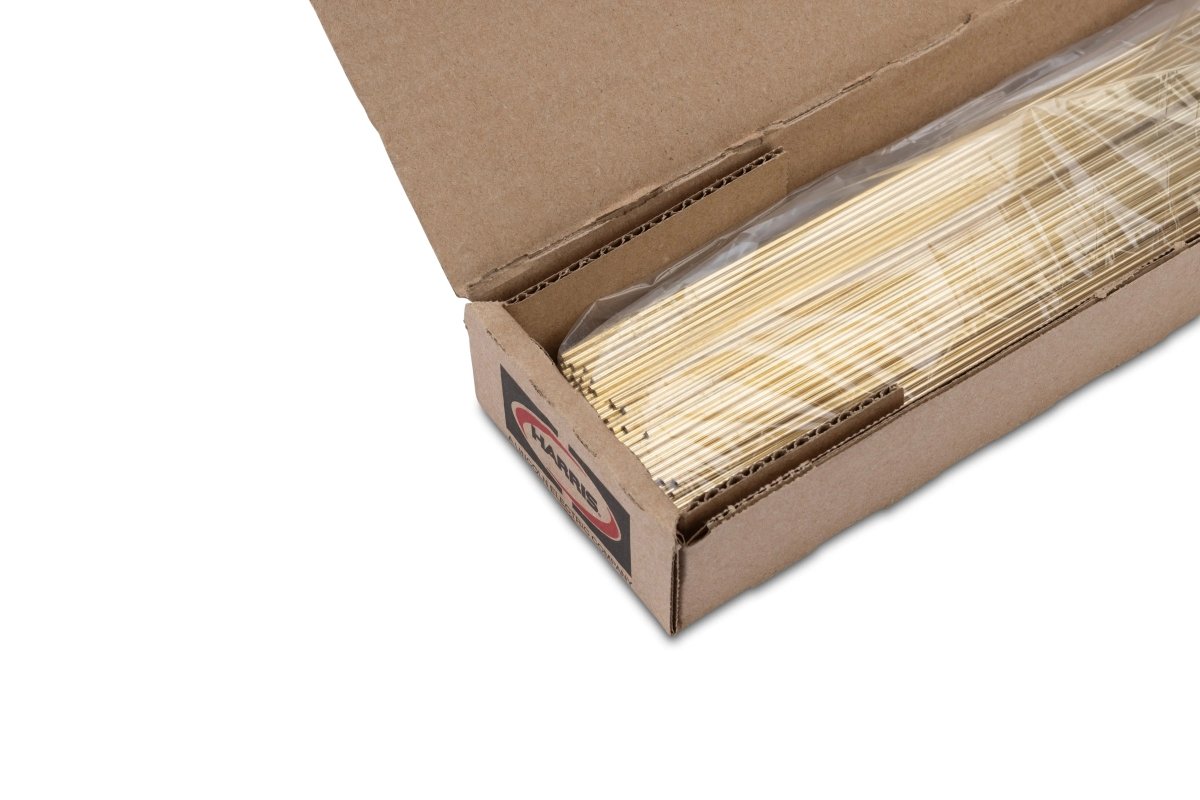 A partially open box contains a Harris Z40N518 – Safety-Silv 40Ni2 high silver brazing alloy (3/32 x 18 in., 300 toz. coil), organized and visible through the clear plastic wrap for easy access.