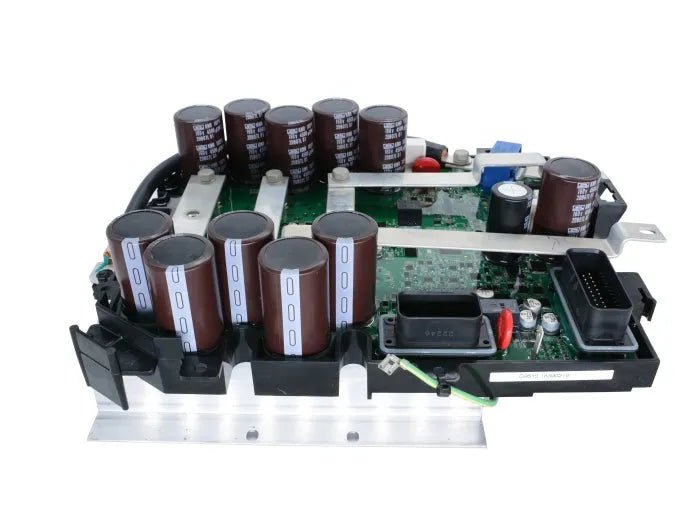A close-up view of an electronic circuit board from a Lincoln OEM G11656-1 Chopper and Control Board Assembly, featuring large cylindrical capacitors, connectors, and other components mounted on a metal base.
