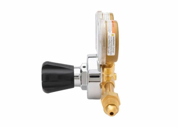 Harris 25GX-200-580 Single Stage Argon Helium Nitrogen Regulator for welding, with gauge and brass fitting, side view on white.