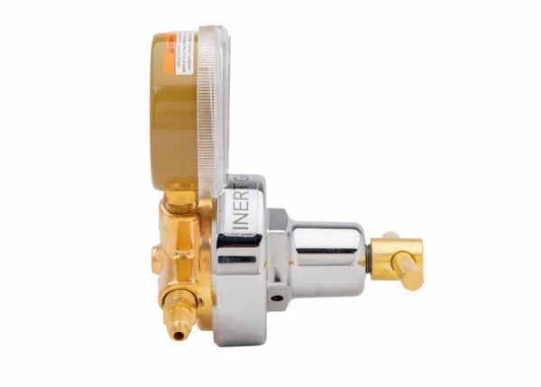 Side view of a metallic single stage regulator with a round pressure gauge labeled INERT, featuring gold and silver components and hose connectors, suitable as an HVAC pressure regulator, isolated on a white background.