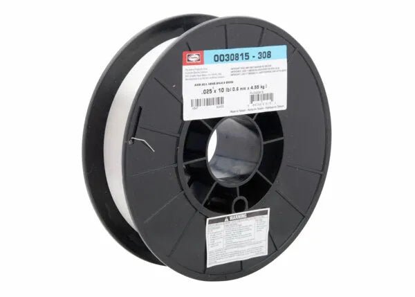 A black plastic spool holds neatly wound Harris 308 Stainless Steel MIG (GMAW) Welding Wire, 0.025 in (0.64 mm), 10 lb, with a blue and white product label and a smaller warning label near the center hole (0030815).