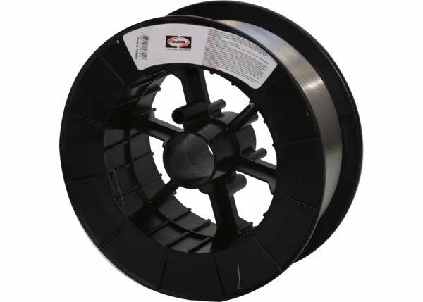 A large black spool holds shiny Harris 308L Stainless Steel MIG GMAW Welding Wire (.0308L15), wound neatly around the core. A white label with text and a barcode is on the side, set against a plain white background for an industrial look.