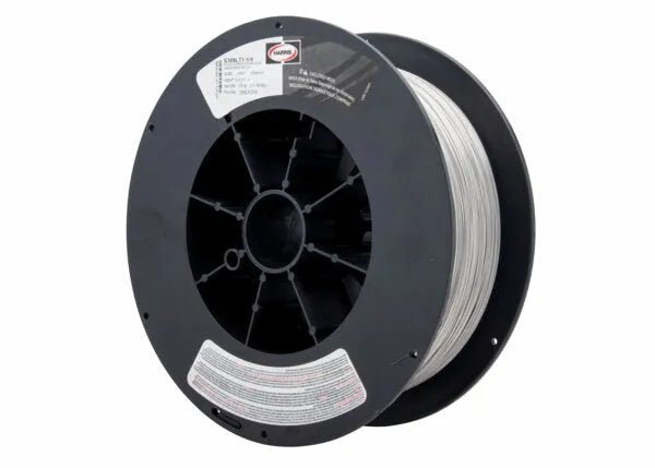 A large black plastic spool with a circular mounting hole holds tightly wound Harris 309LT1-1 Dynacore .035 Stainless Flux-Cored FCAW Welding Wire (309LFC38), 25 lbs. Two white text labels are affixed near the center and bottom edge.