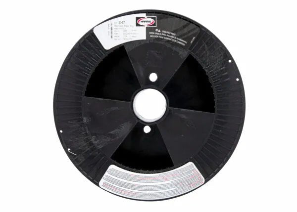 A large black plastic spool with a central hole, radial grooves, and two white label stickers with text and barcodes. This empty spool is designed for packaging Harris 347 .035 Stainless MIG GMAW Welding Wire 25lb SPOOL - 00347F8.