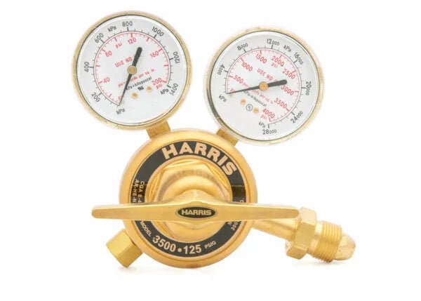 Harris 3500-200-580 welding gas regulator with dual gauges, knob, and inlet for argon, helium, or nitrogen on white background.