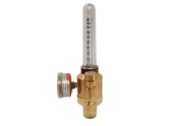 A brass flowmeter regulator for Argon, Helium, or Nitrogen gas features a transparent vertical tube with measurement markings, a round adjustment knob on the side, and is pressure compensated for accurate readings.