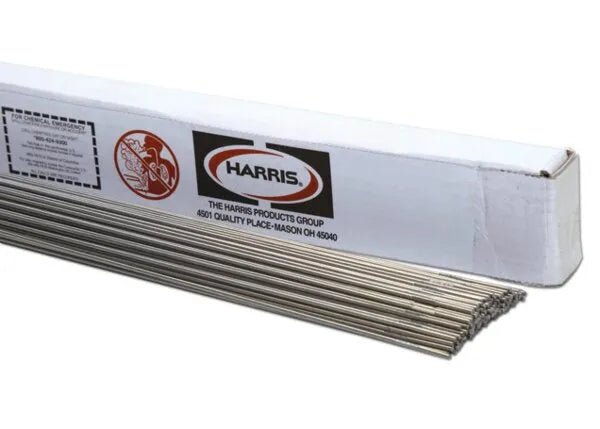 The Harris 410 Stainless TIG GTAW Welding Rods, 3/32 x 36, 10# PKG (0410T50), are shown neatly aligned with some rods partially extending from a white Harris-labeled box featuring company details.