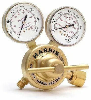 A brass industrial acetylene regulator with two pressure gauges labeled “HARRIS Model 425-125.” The dials display readings in psi and kPa, and there is an attached valve and fitting for gas connections.