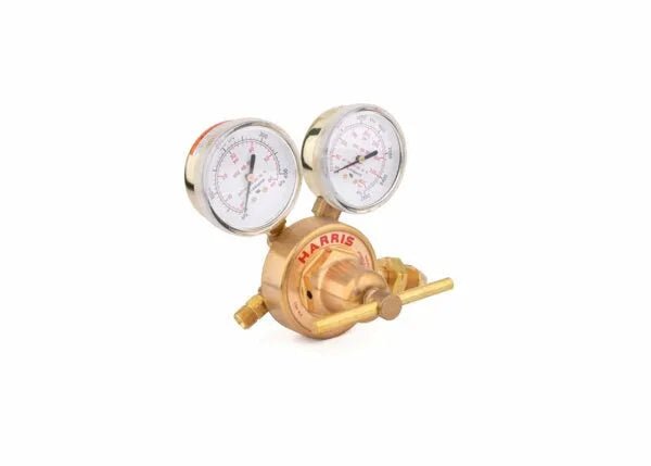A brass Industrial Regulator with two pressure gauges and a control knob, labeled HARRIS. This Single Stage design features clear dials with black and red markings for easy pressure readings.