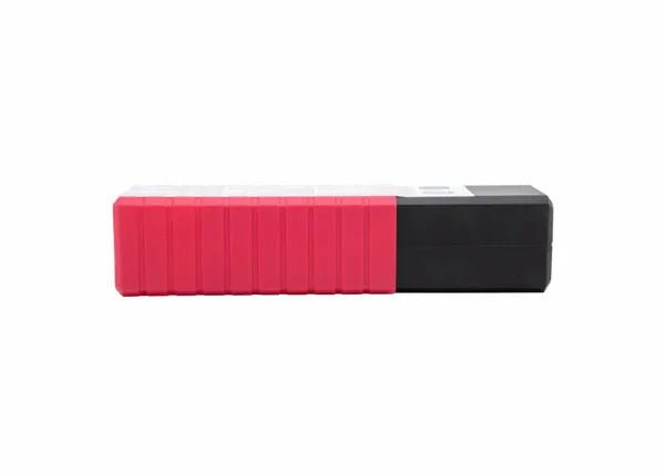 A rectangular object, segmented red on the left and solid black on the right, resembles a Harris 6011 Stick SMAW Electrode 3/32 12 (60115010), with ridged red and smooth black sides hinting at deep penetration welds.