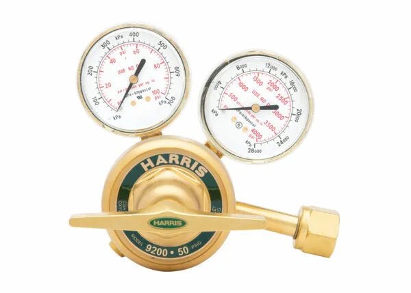 A brass Harris Oxygen regulator with two pressure gauges displaying psi and kPa, featuring a control knob labeled Harris 9200-50—ideal for laboratory industrial and welding applications.