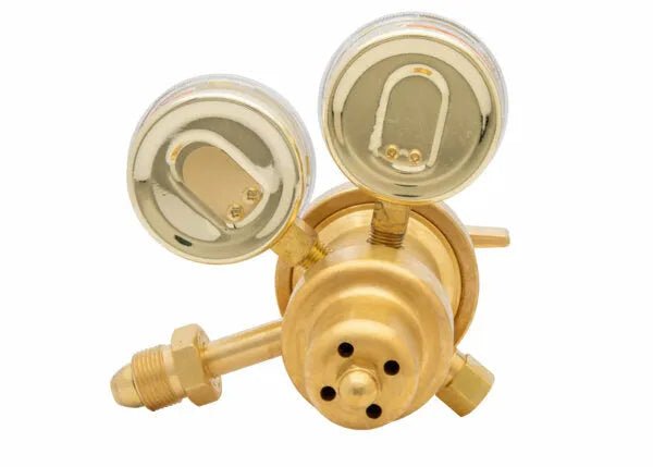 Harris 9200-50-580 two-stage argon/helium/nitrogen welding regulator with dual gauges and fittings, top view, white background.