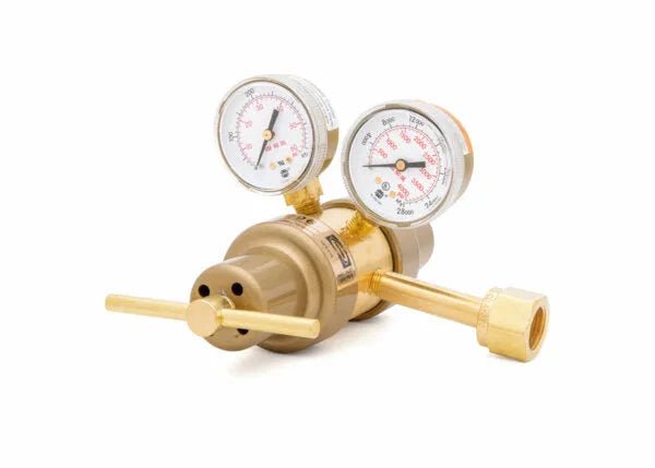 A brass two stage regulator with two round pressure gauges and adjustment handles, used to control and monitor gas flow. Ideal for laboratory applications, this carbon dioxide regulator is photographed on a white background.