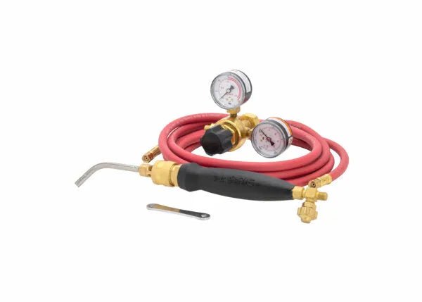 The Harris Inferno 5B Quick Connect Kit CGA-520 - 4400085 includes a red hose, pressure gauges, brass fittings, and black handle. Its angled metal nozzle is ideal for acetylene gas. A small metal tool is shown in front on a white background.