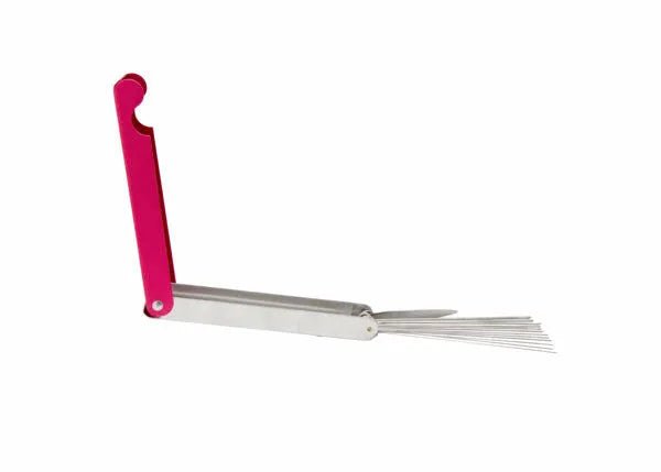 The Harris King Tip Cleaner - 2010690 features a red handle with a hook-shaped top and a metal body. Partially unfolded, it reveals multiple thin prongs fanned out from one end. The tool is shown isolated on a white background.