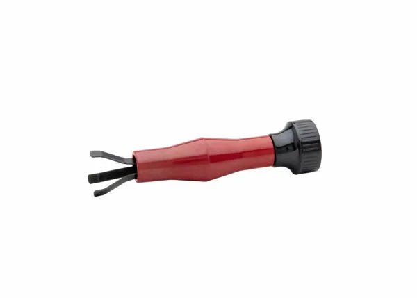 The Harris MIG Nozzle Cleaner - 3060030 is a red and black hand tool with a short cylindrical handle, black rotating cap, and two metal prongs like a small fork—perfect for cleaning MIG nozzles. Shown against a white background.