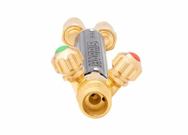 The Harris 1401156 19-6 Combination Torch Handle features four ports, front knurled valves (two color-coded: green and red), HARRIS engraving, and FlashGuard check valves. Shown on a white background.