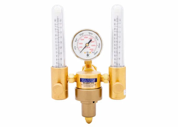 A brass dual flowmeter regulator with two vertical glass flow meters, a central pressure gauge, and labeled HARRIS Model 355. This argon helium flowmeter is used for controlling and measuring precise gas flow rates.
