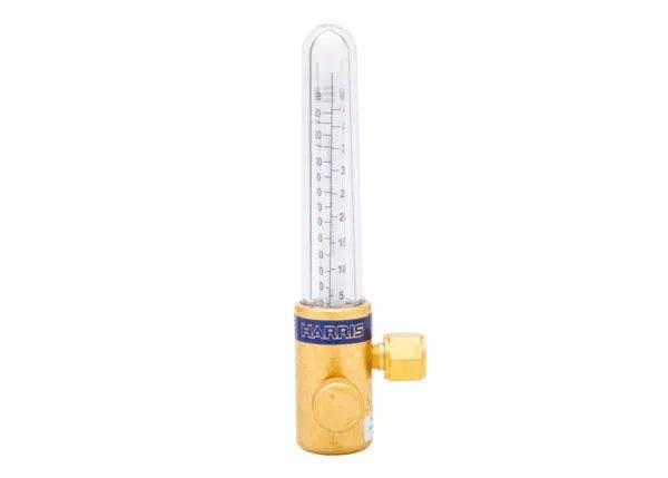 A compensated flowmeter for gas-shielded arc welding, this brass device features a transparent vertical tube with a marked scale for precise flow control; HARRIS is printed on the metal base.