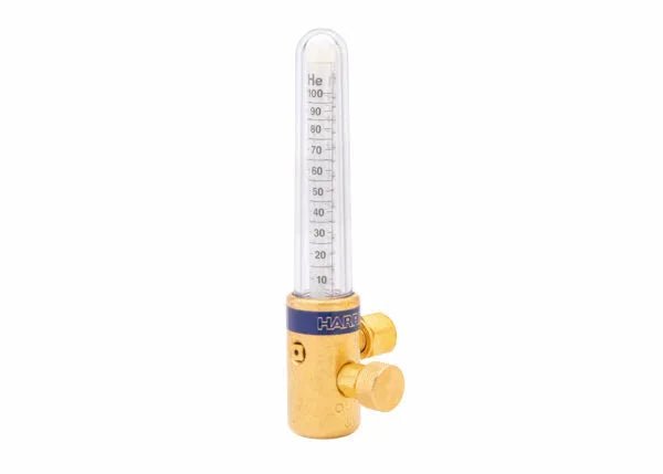 A compensated flowmeter for gas-shielded welding, this brass device features a vertical transparent tube marked 0–100 SCFH and labeled He for helium. The base includes two adjustment knobs and a blue band reading HART.