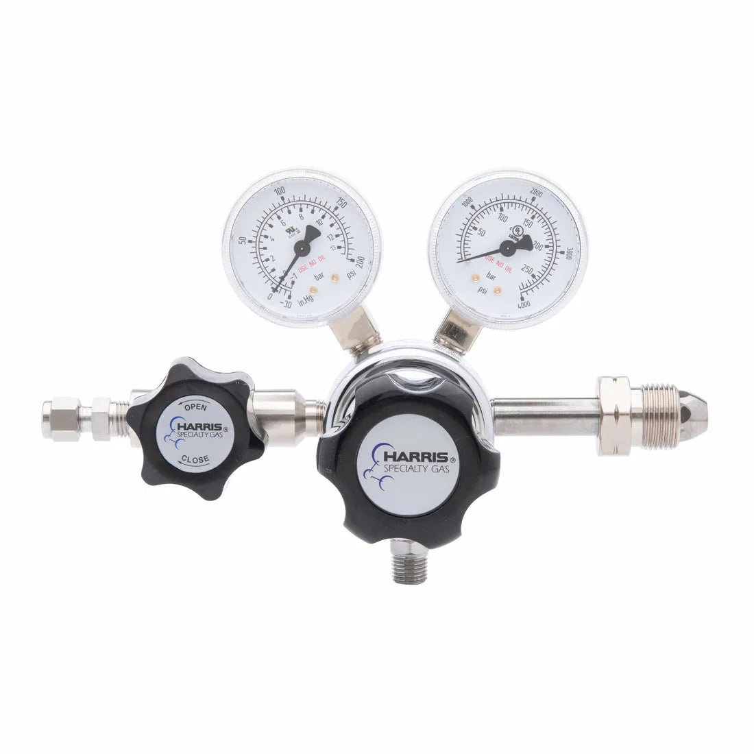 The Harris 701-125-590-BE Carbon Monoxide/Nitrous Oxide Regulator features two pressure dials and adjustment knobs, designed for precise gas flow control in laboratory or industrial environments.