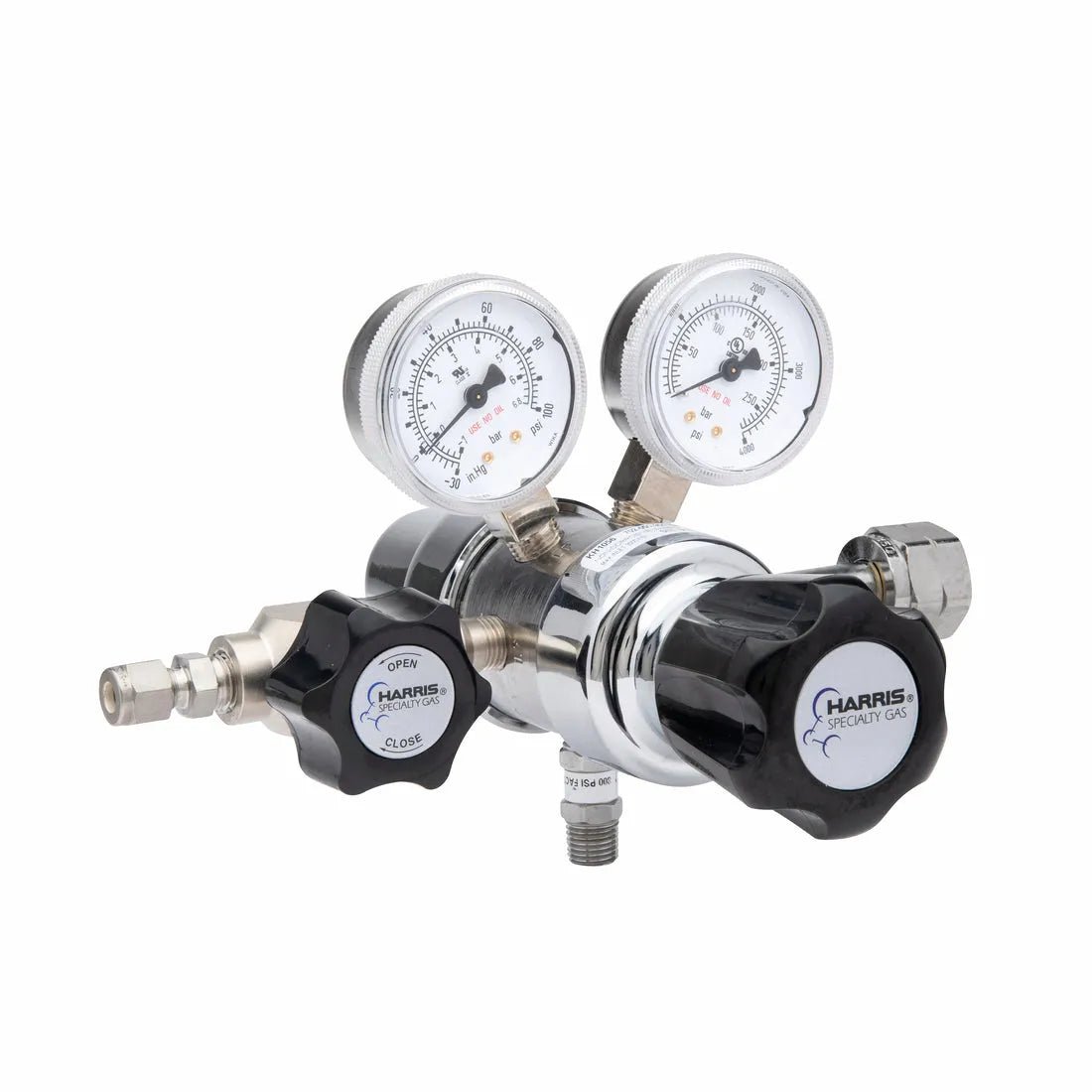 The Harris 702-050-350-BE is a dual-gauge, high purity regulator with a stainless steel diaphragm, open/close control knob, two pressure dials, and cylinder fittings for chlorine, carbon monoxide, propane, or hydrogen. Metallic with black and white accents.