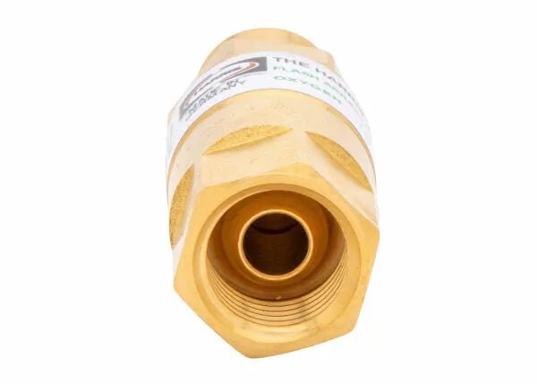 Close-up of the Harris Model 88-5N FBTR Torch-Type Flashback Arrestor (R) - 4301628, showing its brass hexagonal body with threaded interior facing the camera; a partially visible label and small logo are seen on the side.