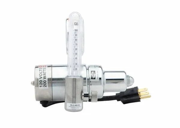 A Harris 3100406 - HP725-100SCFH-580 240 volt flowmeter regulator is attached vertically to a silver CO2 generator. The device has a black three-prong power cord and label, all shown against a white background.