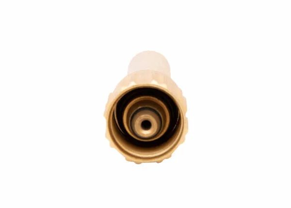 Close-up view of the front end of a beige plastic hose nozzle or connector, part of a positive pressure mixing system, photographed against a plain white background.