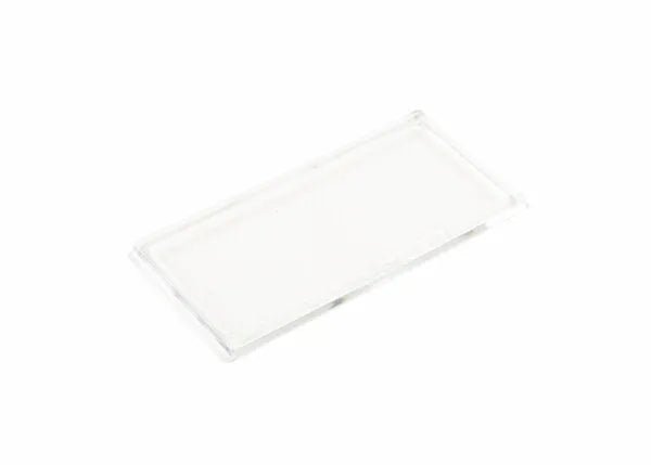 Rectangular clear glass microscope slide, resembling a welding helmet magnifying lens, on a white background. WeldingMart tools.