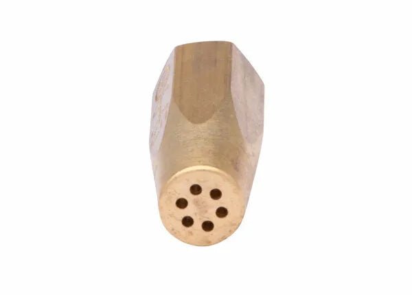 A brass oxy-acetylene welding tip with a hexagonal body and six small round holes arranged in a circle at the tip, shown against a white background.
