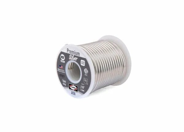 A 25 lb box of Harris 331756 Premium Silver Lead-Free Solid Wire Solder (0.118 in/3.0 mm), featuring a grey-labeled, partially transparent spool tightly coiled with shiny, eco-friendly solder; product details and certifications visible. Plain white background.