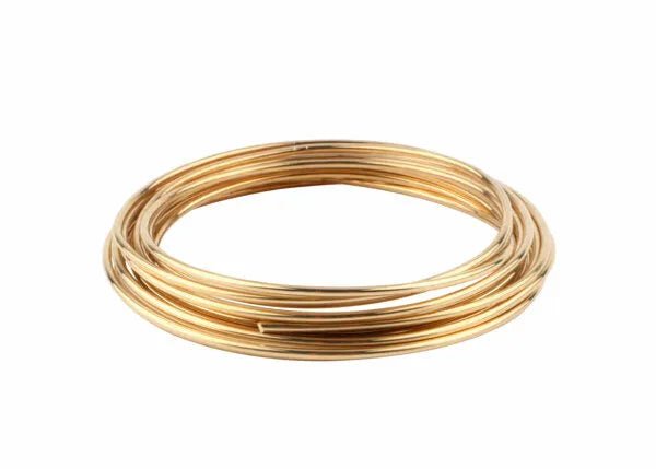 A coil of Harris 4531 - Safety-Silv 45 Silver Brazing Alloy, 1/16 in (1.6 mm), 1 toz cup, is neatly wound into a circular shape and displayed on a white background.