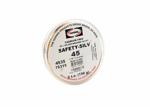 A round plastic container labeled “Harris 4535 - Safety-Silv 45 Silver Brazing Alloy, 1/16 in (1.6 mm), 5 toz Cup” holds cadmium-free filler metal and displays the product number 4535 on the label.