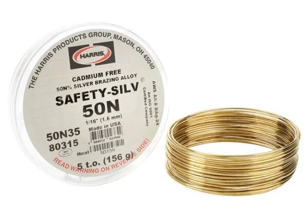 A coil of Harris 50N35 Safety-Silv 50N silver brazing alloy, 1/16 in (1.6 mm), 5 toz cup, lies next to its labeled container—a reliable, cadmium-free filler metal from The Harris Products Group, Made in USA.