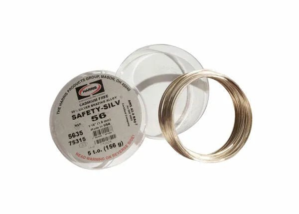 A cadmium-free coil of Harris 5635 Safety-Silv 56 Silver Brazing Alloy, 1/16 in (1.6 mm), sits beside a white cup lid labeled “5 toz,” displaying product details and numbers in black and red on a white background.