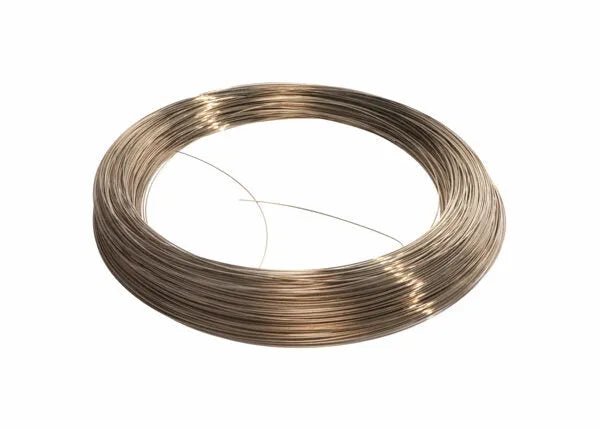 A tightly coiled loop of Harris 56150 - Safety-Silv 56 Silver Brazing Alloy, 1/32 in (0.8 mm), is displayed on a white background with a short length extending, showcasing its flexibility and reflective, cadmium-free surface.