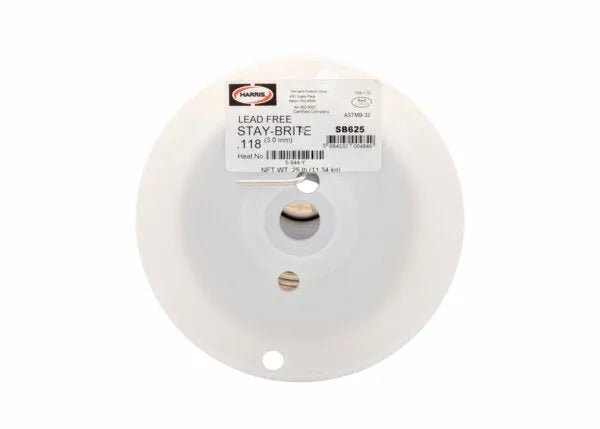 A white plastic spool labeled “Harris Stay Brite Lead-Free Solid Wire Solder - 0.118 in (3.0 mm) - 25 lb Spool - SB625” is shown from above, with a visible coil of solder, product info, and barcode on the label.