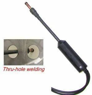 A welding tool with a black handle and cable, shown next to a close-up image of its tip performing thru-hole welding on metal. The text Thru-hole welding appears below the inset. This stud welding gun is ideal for precise applications.
