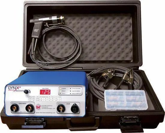 A portable plastic case containing a blue LYNX+ and LYNX4 electroejaculator device, cables, a control panel with digital display, a handheld probe, and a small clear box with compartments for accessories.