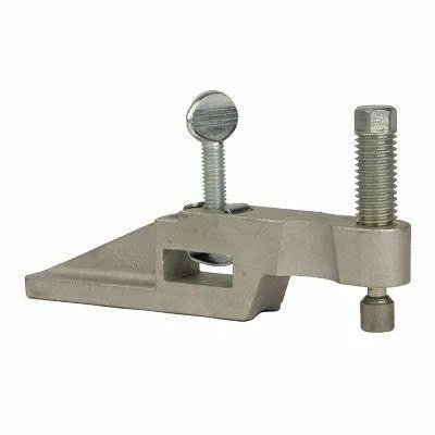 A metal clamp with an angled base, a large threaded bolt on one side, and a round-headed screw on top, ideal for pipe alignment or industrial fit-up to securely hold objects in place.