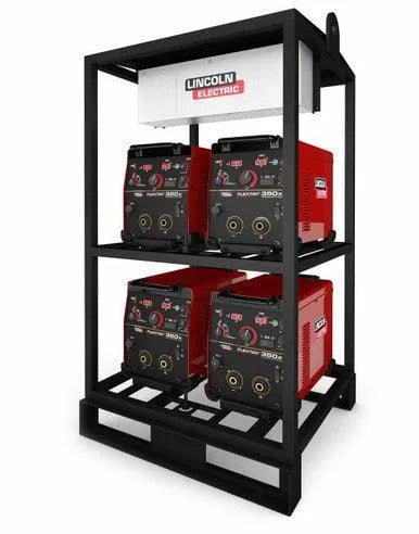 The Lincoln 4-PACK RACK FLEXTEC 350X (CONSTRUCTION MODEL) K4276-1 holds four welders on a sturdy black metal rack with a white Lincoln Electric control box, making it perfect for construction jobsites or fabrication shops.
