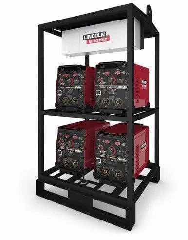 The Lincoln 4-PACK RACK FLEXTEC 350X (STANDARD MODEL) K4280-1 features a black metal rack with four red multi-process welders—two per shelf—and a white control box on top, offering an organized, industrial setup ideal for fabrication shops or jobsites.
