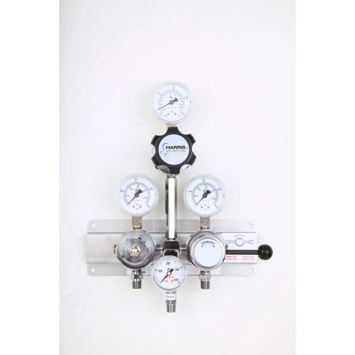 A Lincoln 4700260 Manifold 900BR1R361L36580 S/Over, featuring multiple gauges and knobs, is mounted on a white wall to provide precise control of gas flow and pressure readings as an essential fluid distribution component.
